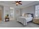 This light-filled main bedroom has neutral decor, ceiling fan, and an open-concept design at 16397 Sheridan Dr, Parker, CO 80134