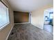 Bright living room with new flooring and a view into the adjacent kitchen area at 2696 S Grove St, Denver, CO 80219