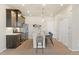 Modern kitchen featuring stainless appliances, island with seating, and stylish pendant lighting at 9445 W 58Th Cir # C, Arvada, CO 80002