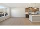 Spacious open-concept living area with wood-look floors and bright natural light at 9445 W 58Th Cir # C, Arvada, CO 80002