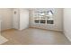 Bright living room with large window and wood-look flooring at 9445 W 58Th Cir # C, Arvada, CO 80002