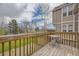 Inviting back deck, perfect for outdoor dining and overlooks manicured grass and neighborhood at 9689 W Chatfield Ave # H, Littleton, CO 80128