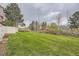 Spacious backyard with green grass, ideal for outdoor activities and relaxation at 9689 W Chatfield Ave # H, Littleton, CO 80128