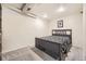 Bedroom with bed, wall picture, carpet, light and neutral colored walls at 9689 W Chatfield Ave # H, Littleton, CO 80128