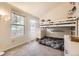 Bright bedroom with a bunkbed, two windows, and neutral colored walls at 9689 W Chatfield Ave # H, Littleton, CO 80128