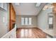 Bright and spacious living room featuring a fireplace, skylights, and hardwood floors at 9689 W Chatfield Ave # H, Littleton, CO 80128
