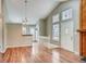 Bright living area with vaulted ceilings, wood floors, and a large window for plenty of natural light at 9689 W Chatfield Ave # H, Littleton, CO 80128