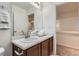 Bathroom featuring a vanity with marble countertop and a view to the hallway at 1998 Coach House Loop, Castle Rock, CO 80109