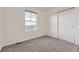 Comfortable bedroom with neutral carpet, a window, and a closet at 1998 Coach House Loop, Castle Rock, CO 80109
