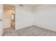 Cozy bedroom with neutral carpet and an open doorway to the hall at 1998 Coach House Loop, Castle Rock, CO 80109