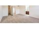 Spacious bedroom with plush carpeting and an open doorway to the bathroom at 1998 Coach House Loop, Castle Rock, CO 80109