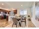 Dining room showcasing modern table setting, ample natural light, and seamless access to the kitchen at 1998 Coach House Loop, Castle Rock, CO 80109