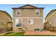 Back of the property with siding, brick area, and a small set of stairs at 1998 Coach House Loop, Castle Rock, CO 80109