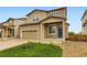 Two-story home featuring a two-car garage, blue door, and well-maintained front yard with green grass at 1998 Coach House Loop, Castle Rock, CO 80109