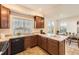 Well-lit kitchen featuring granite countertops, modern appliances, and a breakfast bar at 1998 Coach House Loop, Castle Rock, CO 80109