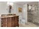 Bathroom with vanity, toilet, and large walk-in shower at 757 N Bluff Dr, Franktown, CO 80116