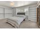 Bedroom with built-in shelving and window seat at 757 N Bluff Dr, Franktown, CO 80116