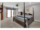 Bedroom with a four-poster bed and carpet flooring at 757 N Bluff Dr, Franktown, CO 80116