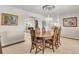 Bright dining room with a formal table and chandelier at 757 N Bluff Dr, Franktown, CO 80116