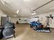 Finished garage with cabinets and a four-wheeler at 757 N Bluff Dr, Franktown, CO 80116