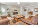 Spacious living room featuring a fireplace and comfortable seating at 757 N Bluff Dr, Franktown, CO 80116