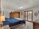 Inviting main bedroom with warm lighting, closet, and access to balcony at 757 N Bluff Dr, Franktown, CO 80116