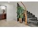 Elegant staircase with marble steps and wooden railing at 757 N Bluff Dr, Franktown, CO 80116