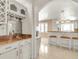 Wet bar with granite countertop and wine glass rack at 757 N Bluff Dr, Franktown, CO 80116