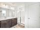 Modern bathroom with double vanity and large shower at 13432 E 110Th Way, Commerce City, CO 80022