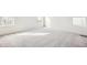 Bright bedroom with neutral carpeting and large windows at 13432 E 110Th Way, Commerce City, CO 80022