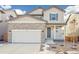Two-story house with stone and siding exterior at 13432 E 110Th Way, Commerce City, CO 80022