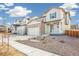 Two-story house with stone accents and a front porch at 13432 E 110Th Way, Commerce City, CO 80022
