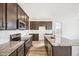 Modern kitchen with stainless steel appliances and an island at 13432 E 110Th Way, Commerce City, CO 80022