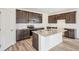 Bright kitchen boasts granite countertops and a large island at 13432 E 110Th Way, Commerce City, CO 80022