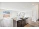 Open concept kitchen with island and access to backyard at 13432 E 110Th Way, Commerce City, CO 80022