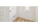 Laundry area with washer and dryer hookups, and built-in shelving at 13432 E 110Th Way, Commerce City, CO 80022
