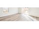 Living room with hardwood floors and sliding glass door at 13432 E 110Th Way, Commerce City, CO 80022