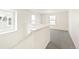 Spacious loft area with neutral carpet and multiple windows at 13432 E 110Th Way, Commerce City, CO 80022