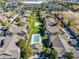 Aerial shot of a neighborhood featuring a community pool and mature trees at 4385 S Balsam St # 10-103, Littleton, CO 80123