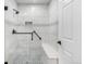 Modern tiled shower with glass door and built in bench at 4385 S Balsam St # 10-103, Littleton, CO 80123