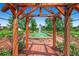 Beautiful water fountain surrounded by lush greenery, viewed through a wooden trellis structure at 4385 S Balsam St # 10-103, Littleton, CO 80123