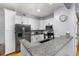 Bright kitchen boasts granite countertops, stainless appliances, and white cabinets at 4385 S Balsam St # 10-103, Littleton, CO 80123