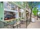 Charming storefront featuring outdoor seating, large windows, and inviting signage at 4385 S Balsam St # 10-103, Littleton, CO 80123