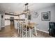 Elegant dining area featuring a modern light fixture and dining table at 2900 Purcell St # F1, Brighton, CO 80601