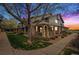 Charming townhome exterior showcasing the inviting porch and landscaped front yard at 2900 Purcell St # F1, Brighton, CO 80601
