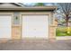 Garage door with a brick base on a home's exterior at 2900 Purcell St # F1, Brighton, CO 80601