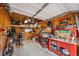 Organized garage with tools, motorcycle, and workspace, great for hobbies at 2900 Purcell St # F1, Brighton, CO 80601