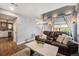Cozy living room with a leather couch, marble coffee table, and hardwood floors at 2900 Purcell St # F1, Brighton, CO 80601
