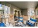 Relaxing outdoor patio with comfortable seating and brick accents at 2900 Purcell St # F1, Brighton, CO 80601