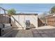 Backyard featuring a grill, shed and a seating area with paved stones at 12455 W Alameda Dr, Lakewood, CO 80228